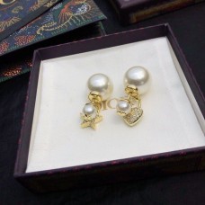 Autentické šperky Christian Dior s CD krystaly, hvězdou a srdcem, asymetrické přívěsky, bílá perla, náušnice ze žlutého zlata.